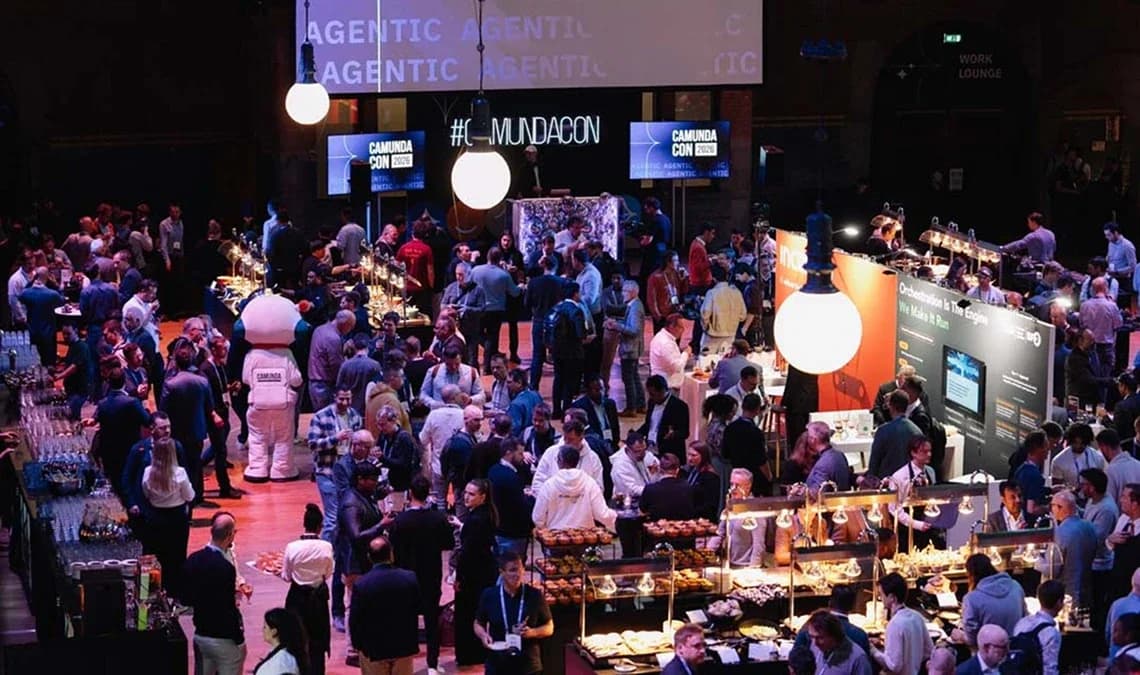 A crowded evening reception in the exhibition hall